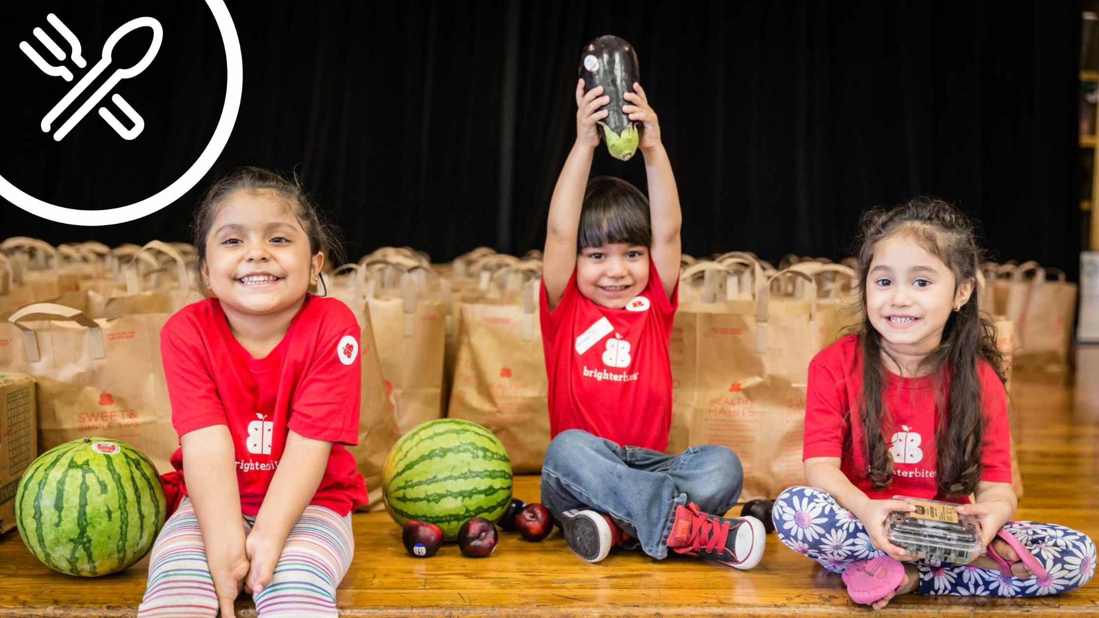 Local Line partners with food donation platform Brighter Bites. Picture of children with brown Brighter Bites bags and produce. Local Line Logo.