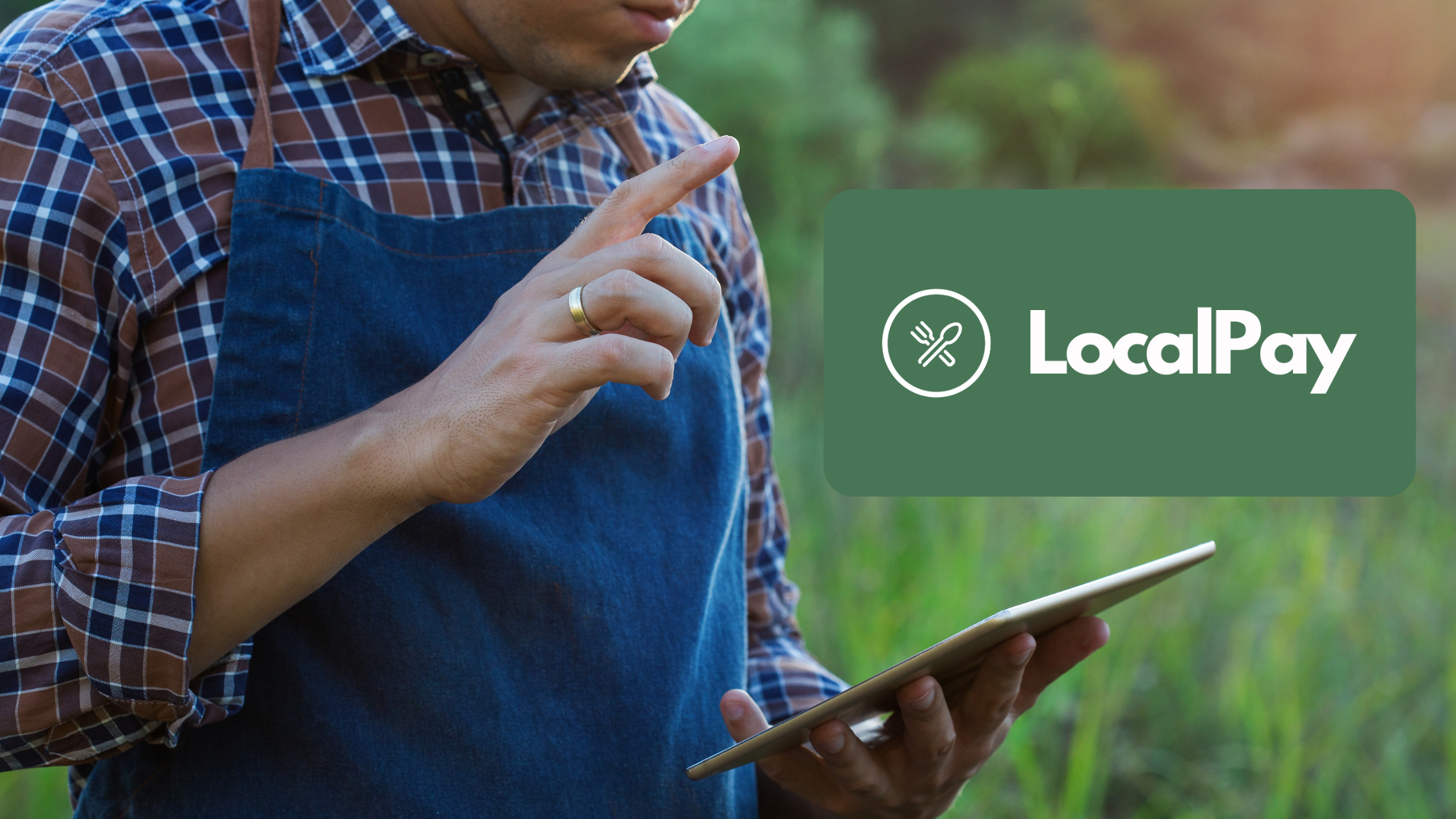 Man with ipad in field with LocalPay logo on top.