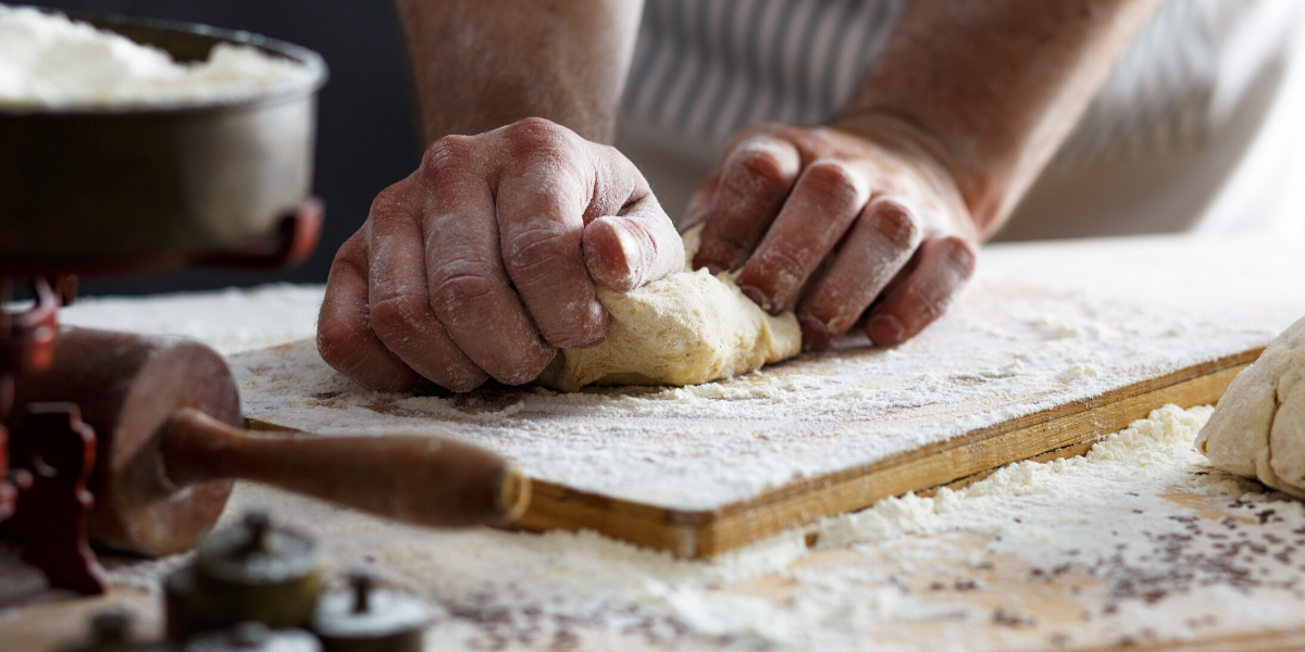 Baker's hands kneading dough